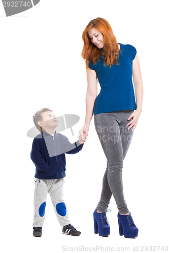 Image of Pretty smiling woman posing with a little boy