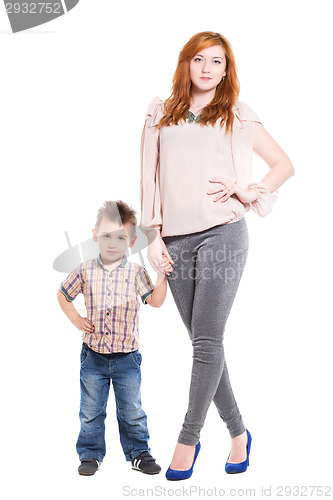 Image of Young redhead woman posing with her little son