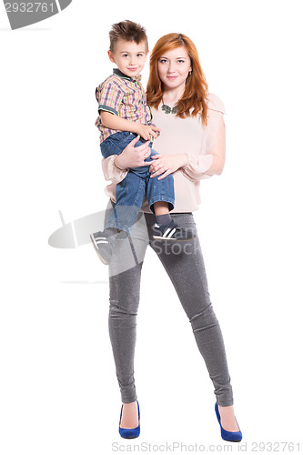 Image of Redhead woman posing with a little boy