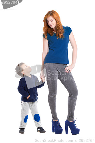 Image of Young redhead woman with boy