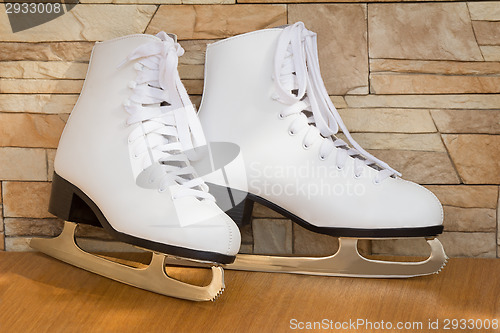 Image of The female skates and boots of white color for figure skating.