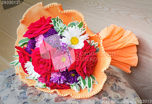 Image of Bunch of flowers: roses, asters, camomiles the beautifully packe