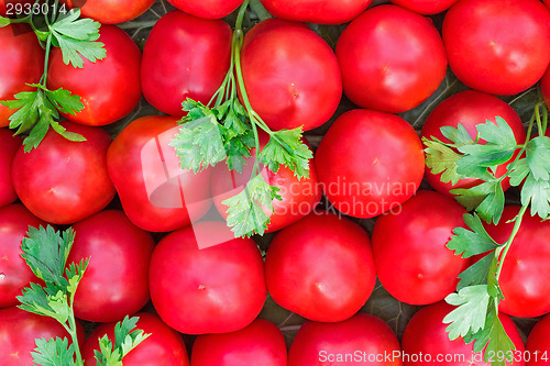 Image of Ripe tomatoes of bright red color of the small size.