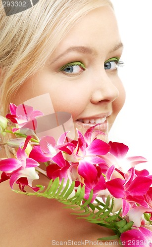 Image of lovely blond with orchid