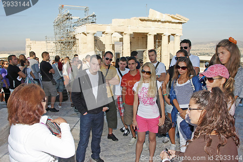 Image of Tourists sightseeing Temple of Athena Nike in Acropolis