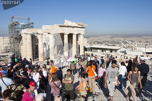 Image of Tourists sightseeing Temple of Athena Nike in Athens