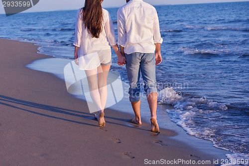 Image of young couple  on beach have fun