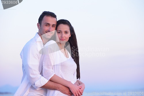 Image of young couple  on beach have fun