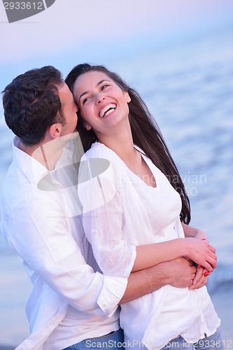Image of young couple  on beach have fun