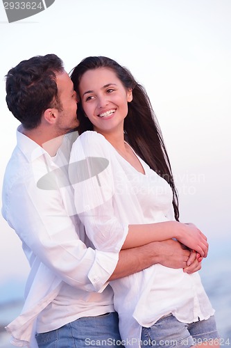 Image of young couple  on beach have fun