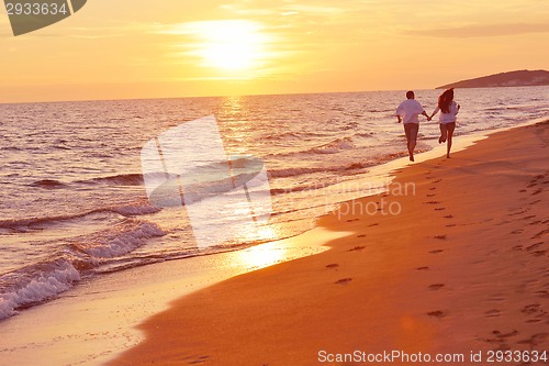 Image of young couple  on beach have fun