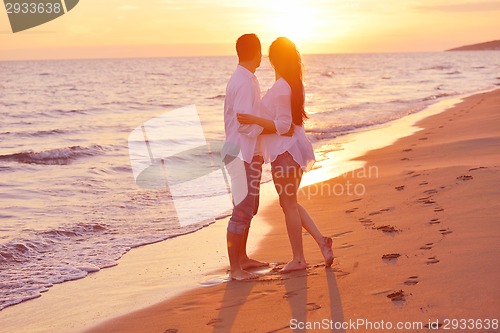 Image of young couple  on beach have fun