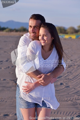 Image of young couple  on beach have fun