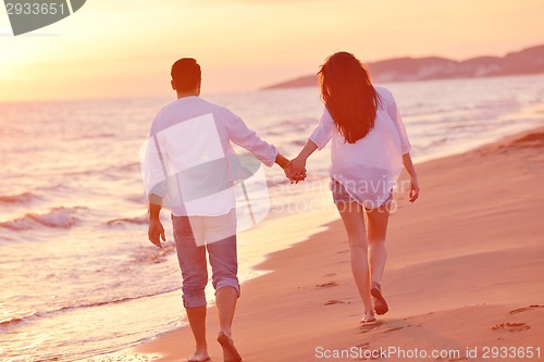 Image of young couple  on beach have fun