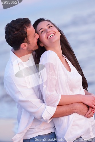 Image of young couple  on beach have fun