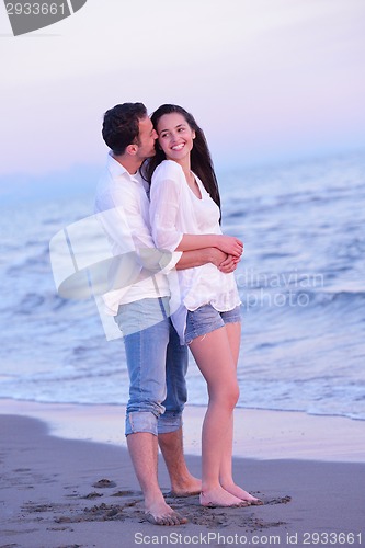 Image of young couple  on beach have fun