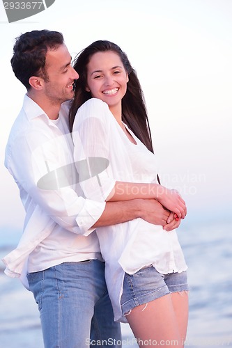 Image of young couple  on beach have fun