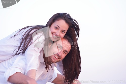 Image of young couple  on beach have fun