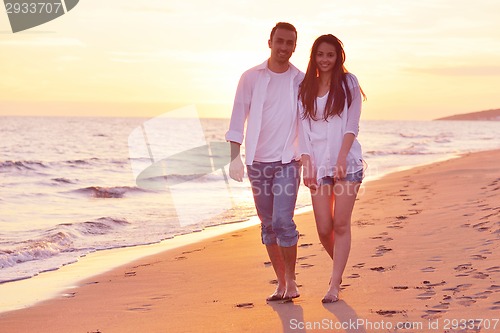 Image of young couple  on beach have fun