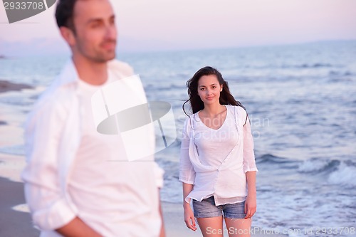 Image of young couple  on beach have fun