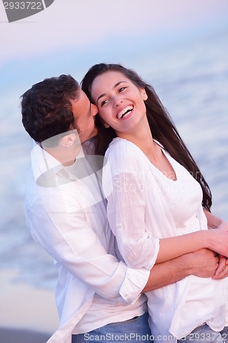 Image of young couple  on beach have fun