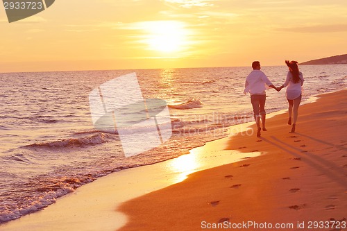 Image of young couple  on beach have fun