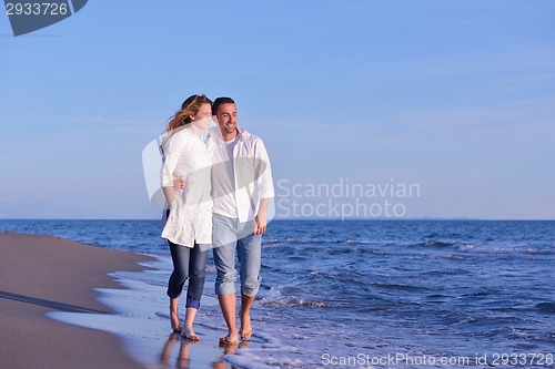 Image of young couple  on beach have fun