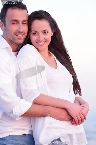 Image of young couple  on beach have fun