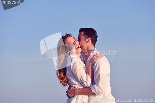 Image of young couple  on beach have fun