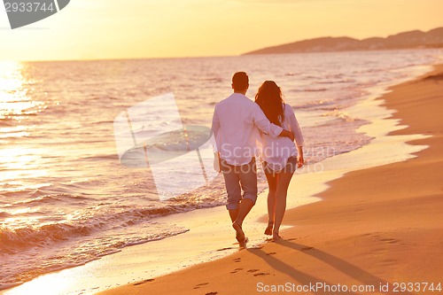 Image of young couple  on beach have fun