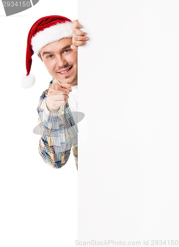 Image of Young man in Santa hat