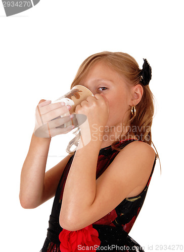 Image of Girl drinking from a mug.