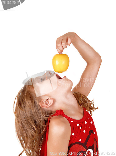 Image of Girl eating an apple.