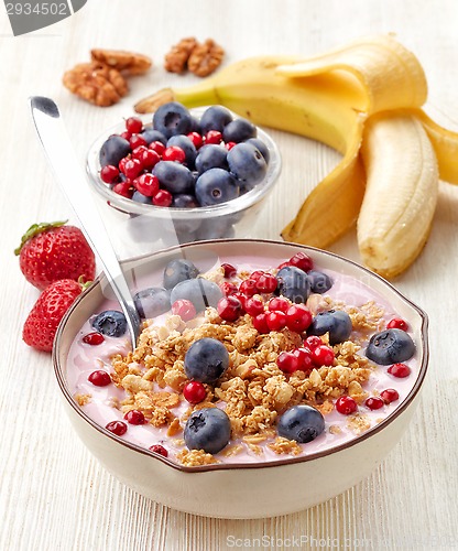 Image of Healthy breakfast. Yogurt with granola and berries