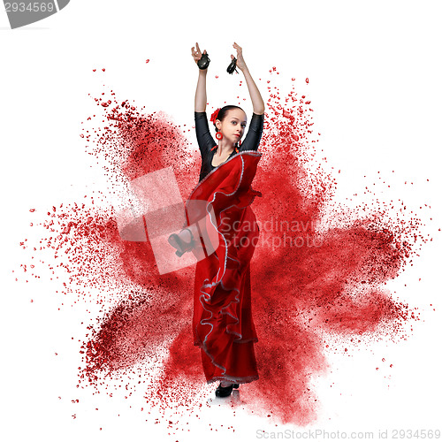 Image of young woman dancing flamenco against explosion