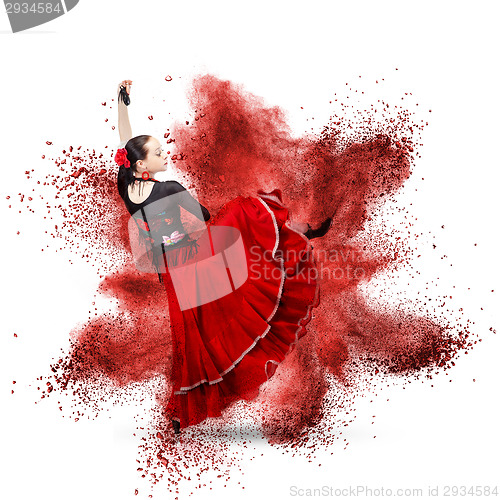 Image of young woman dancing flamenco against explosion