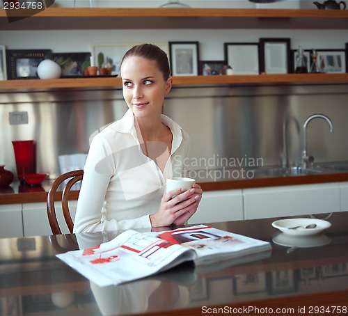 Image of Relaxed woman looking out the window