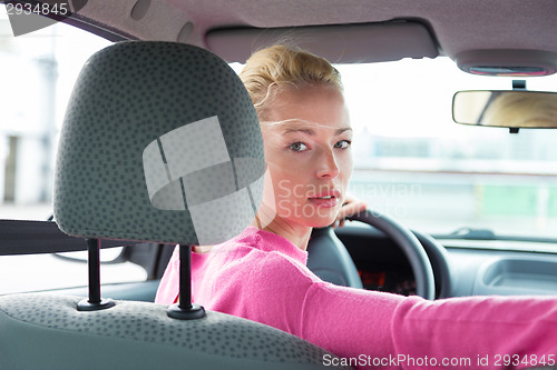 Image of Lady looking back while reversing.