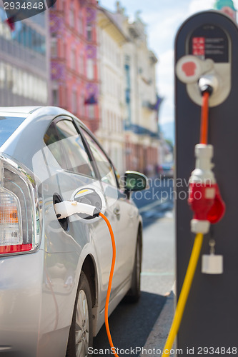 Image of Electric Car in Charging Station.