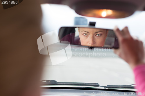 Image of Lady looking back while reversing.