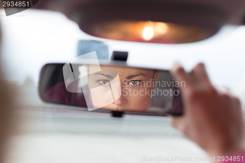 Image of Lady looking back while reversing.