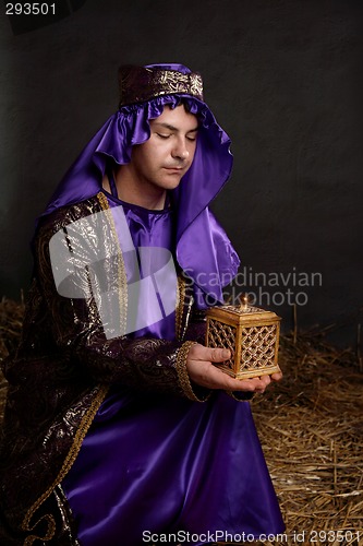 Image of Christmas Nativity - wise man kneeling with a gift