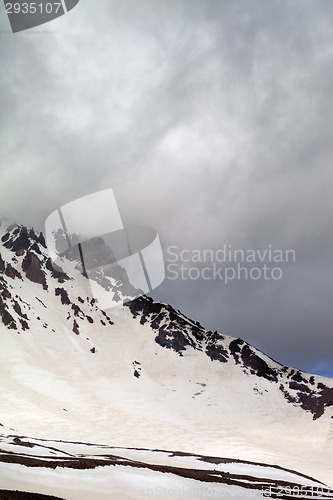 Image of Snowy mountains in storm clouds