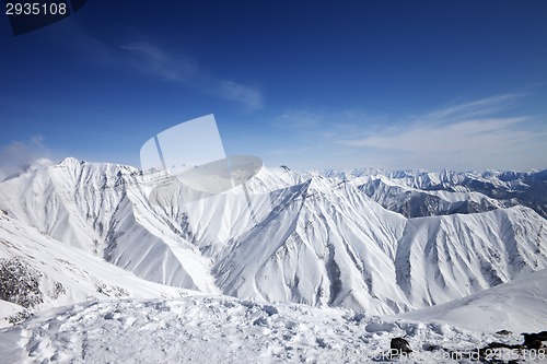 Image of Winter snowy mountains and blue sky