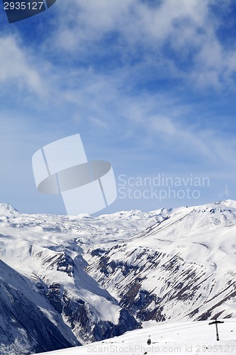 Image of Snowy mountains and ski slope at nice day