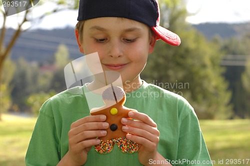 Image of Child holding a donut