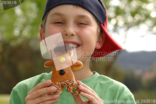 Image of Grinning  boy with a doughnut