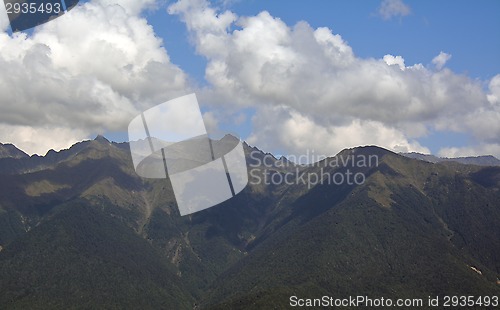 Image of Caucasus mountains in a bright cloudy day