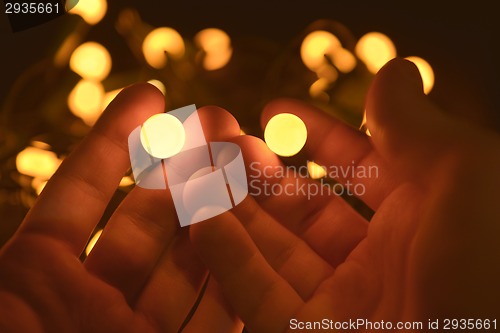 Image of Bright yellow balls in the hands
