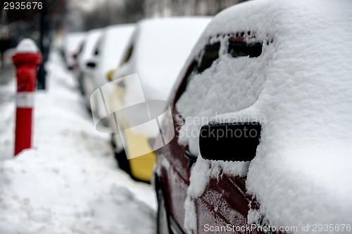 Image of Cars covered in snow after blizzard